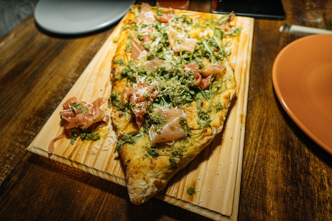 a pizza on a cutting board on a table