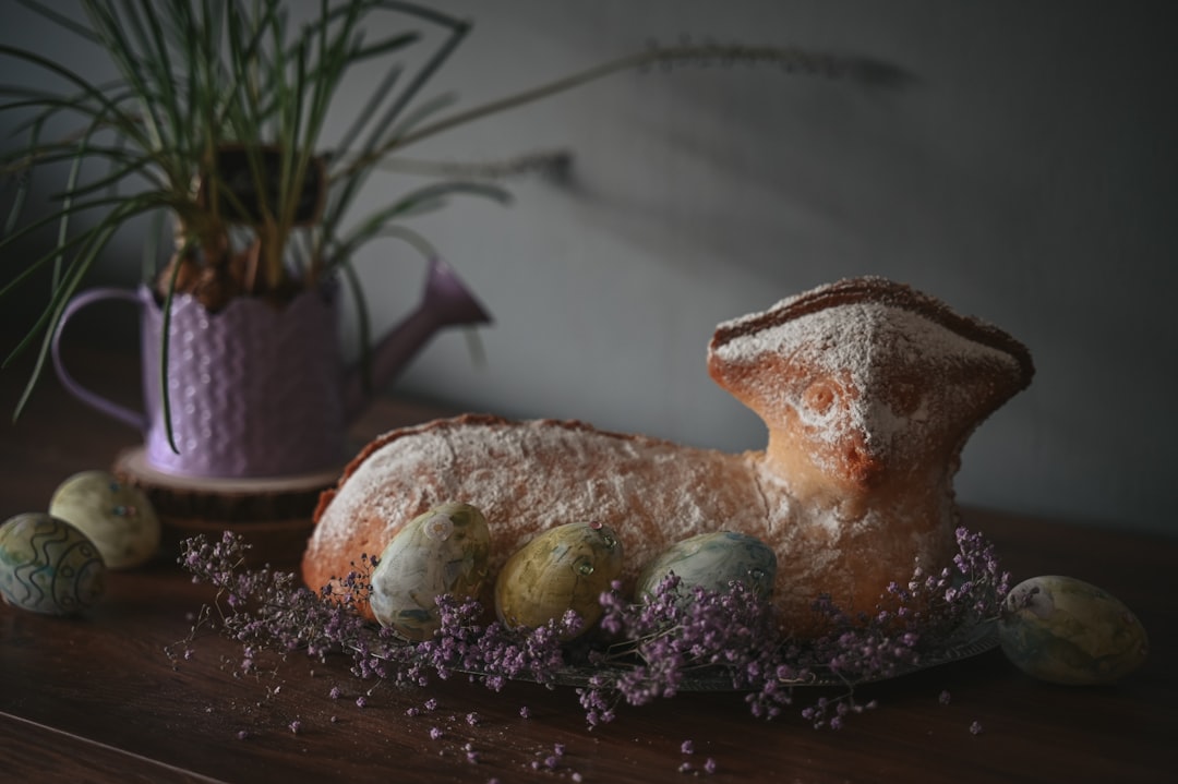 Lamb-shaped bread with easter eggs and flowers