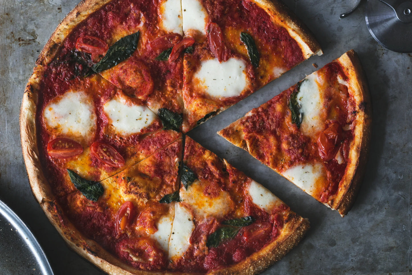 first-slice-of-fresh-margarita-pizza - DoughRise.Store